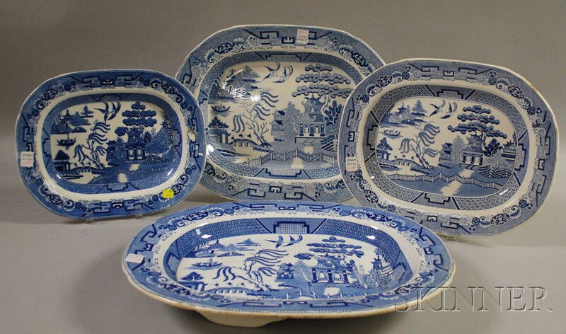 Four Transfer-decorated Blue Willow Pattern Ceram: Four Transfer-decorated Blue Willow Pattern Ceramic Platters, various makers, including a footed well & tree, lg. 13 1/2 to 19 1/4 in.