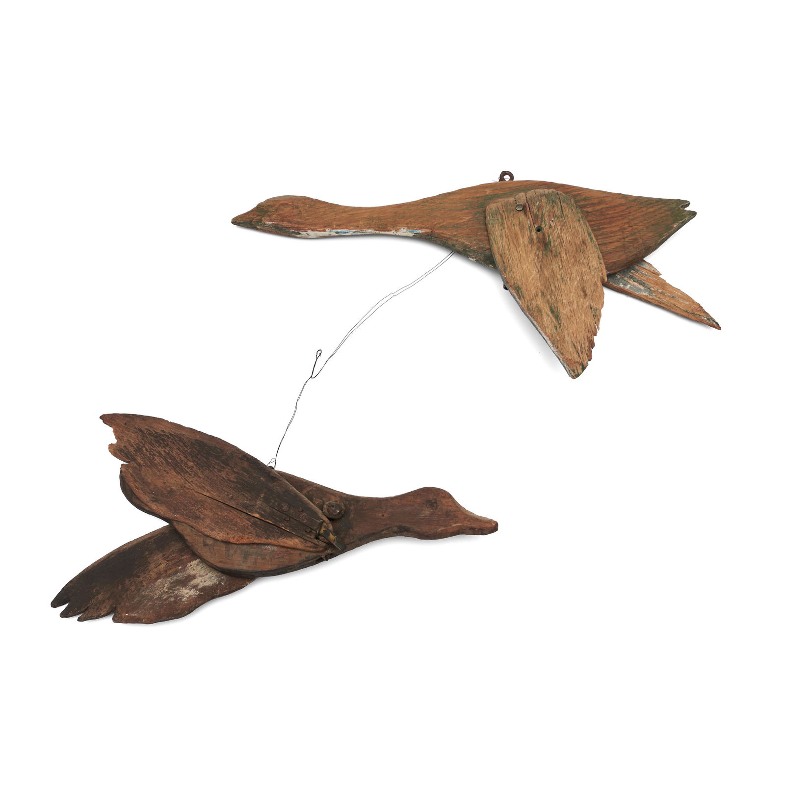 Two Carved Duck Whirligigs, America, 20th century.: Two Carved Duck Whirligigs, America, 20th century. Assembled pair of sawn long-necked birds with adjustable wings, those attached to the dark brown figure having wrought iron bolts and stops, those of
