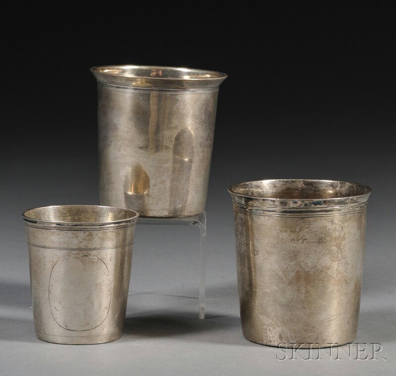 Three Small European Silver Beakers, one English Ge: Three Small European Silver Beakers, one English Georgian, Birmingham, lacking date letter, maker's mark D.G, one French, mid-19th century, Paris, C?sar Tonnelier, maker, and one likely German, Hanau,