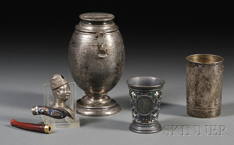 Three Small Russian Silver Items, a small engraved: Three Small Russian Silver Items, a small engraved beaker, Moscow, early 20th century, with maker's mark for Pyetr Baskakov; a polychrome enamel-decorated footed cup, Moscow, c. 1878; and an enamel-de