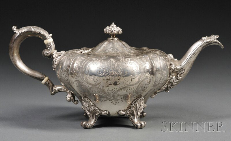 J.E. Caldwell & Co. Sterling Teapot, Philadelphia,: J.E. Caldwell & Co. Sterling Teapot, Philadelphia, early 20th century, the squat melon-shaped reeded body with chased and engraved floral decoration, monogrammed, the handle with ivory heat stops, eng