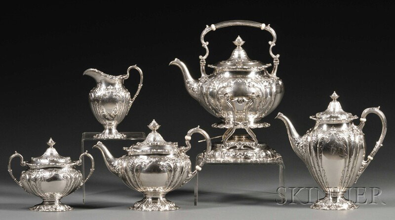 Five-piece Gorham Sterling Coffee and Tea Service,: Five-piece Gorham Sterling Coffee and Tea Service, 1924, comprised of ovoid coffeepot, teapot, creamer, covered sugar, and kettle on stand, all with embossed floral and foliate decoration, scrolled-ed