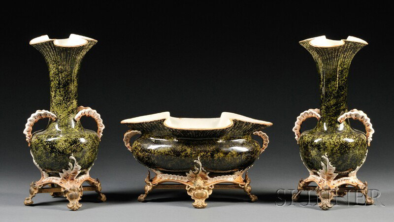 Three-piece Bronze-mounted Majolica Mantel Garnitu: Three-piece Bronze-mounted Majolica Mantel Garniture, Continental, 19th century, a center bowl and two vases, each with quatrefoil rim, black and lime green sponge-decorated body, cream and brown hand