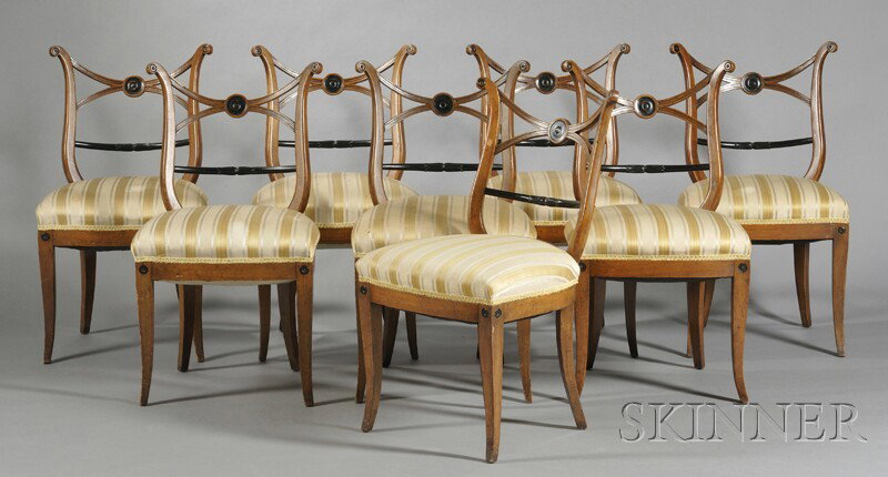 Eight Partial-ebonized Biedermeier Side Chairs, mi: Eight Partial-ebonized Biedermeier Side Chairs, mid-19th century, each with outscrolled stiles joined by X-frame back above medial bar back, on sabre legs, seat ht. 19 in.