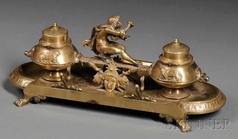 Bronze Figural Inkstand, 19th/early 20th century,: Bronze Figural Inkstand, 19th/early 20th century, with a central Classical male figure crouching in profile and pouring the contents of an amphora into a cup, flanked by two inkwells with hinged lids