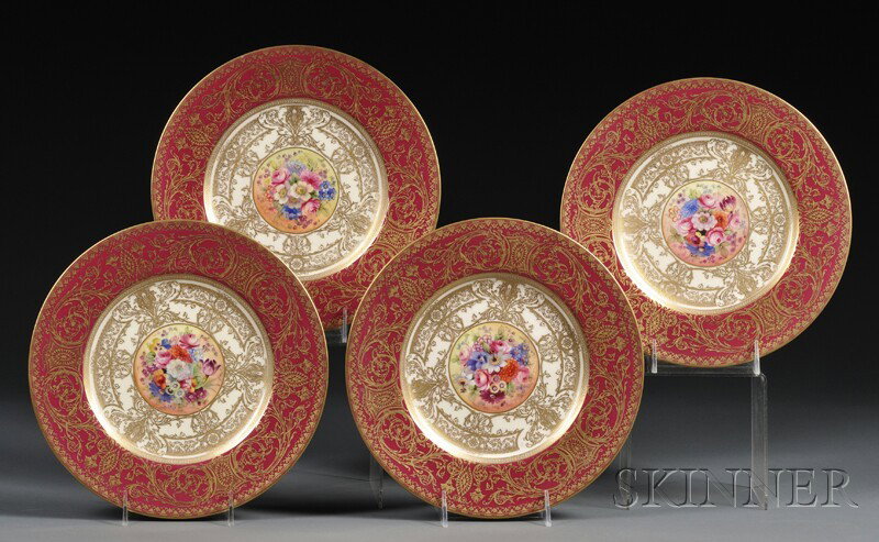 Four Royal Worcester Cabinet Plates, England, 1925: Four Royal Worcester Cabinet Plates, England, 1925, each with central polychrome hand-painted flower spray signed "E. Phillips," surrounded by border of cream, maroon, and gilt, with factory mark, ret