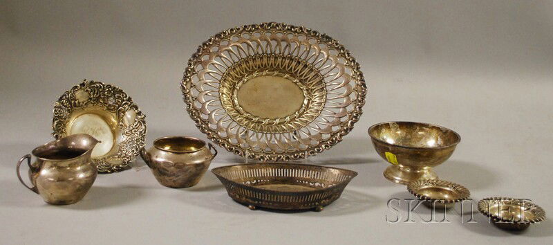 Ten Sterling Silver Table Articles, a Whiting retic: Ten Sterling Silver Table Articles, a Whiting reticulated basket, a Gorham reticulated footed ovoid dish, a Gorham/Whiting Revere-style bowl, an International creamer and sugar set, a small Gorham bow