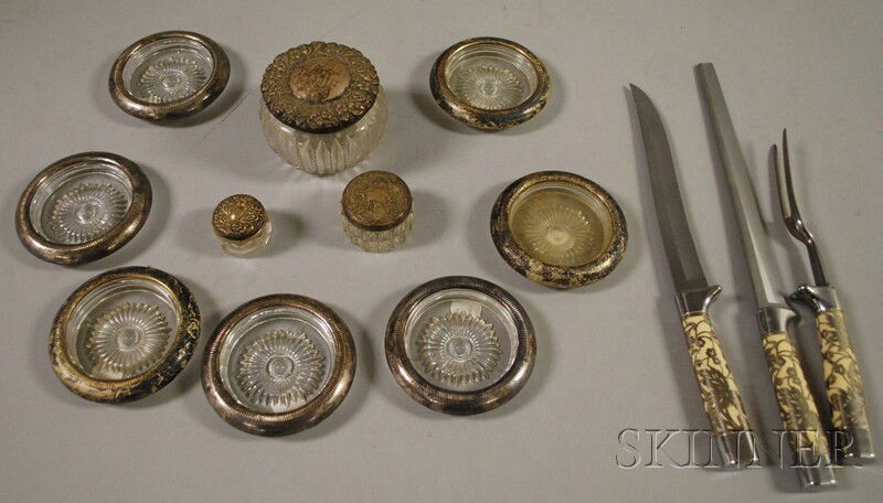 Group of Silver and Silver-mounted Items, three sil: Group of Silver and Silver-mounted Items, three silver-lidded dresser jars, seven silver-mounted pressed glass coasters, and a three-piece Carvel Hall cased carving set.