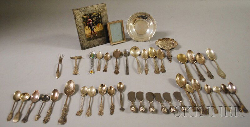 Group of Assorted Silver and Silver-plated Article: Group of Assorted Silver and Silver-plated Articles, including picture frames, a small Towle sterling dish, and a number of flatware items, including numerous souvenir spoons, approx. 9.8 troy oz. sil