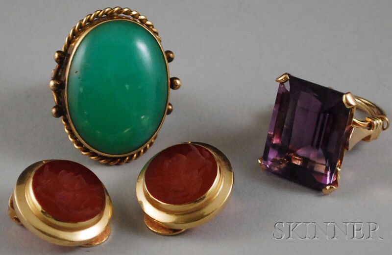 Three 14kt Gold and Stone Jewelry Items, a large: Three 14kt Gold and Stone Jewelry Items, a large green chalcedony ring, an amethyst cocktail ring, and a pair of carved carnelian intaglio earclips, rings size 5 1/2.