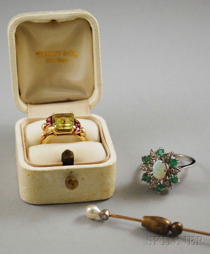 Three Pieces of Jewelry, a 14kt gold, peridot, and: Three Pieces of Jewelry, a 14kt gold, peridot, and ruby Tiffany & Co. ring in original box; a 14kt white gold, opal, emerald, and diamond ring; and a cultured pearl and diamond stickpin; total 6.9 dwt