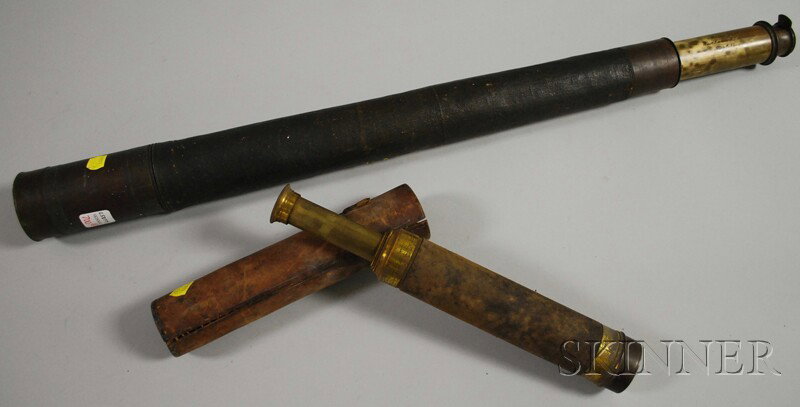 Two Brass Telescoping Spyglasses, the larger a sin: Two Brass Telescoping Spyglasses, the larger a single-draw spyglass with canvas cover, dust cap and slide, and engraved inscription "Moon Jun'r/West India Rd. London/Imp'd Navy"; the smaller a double-