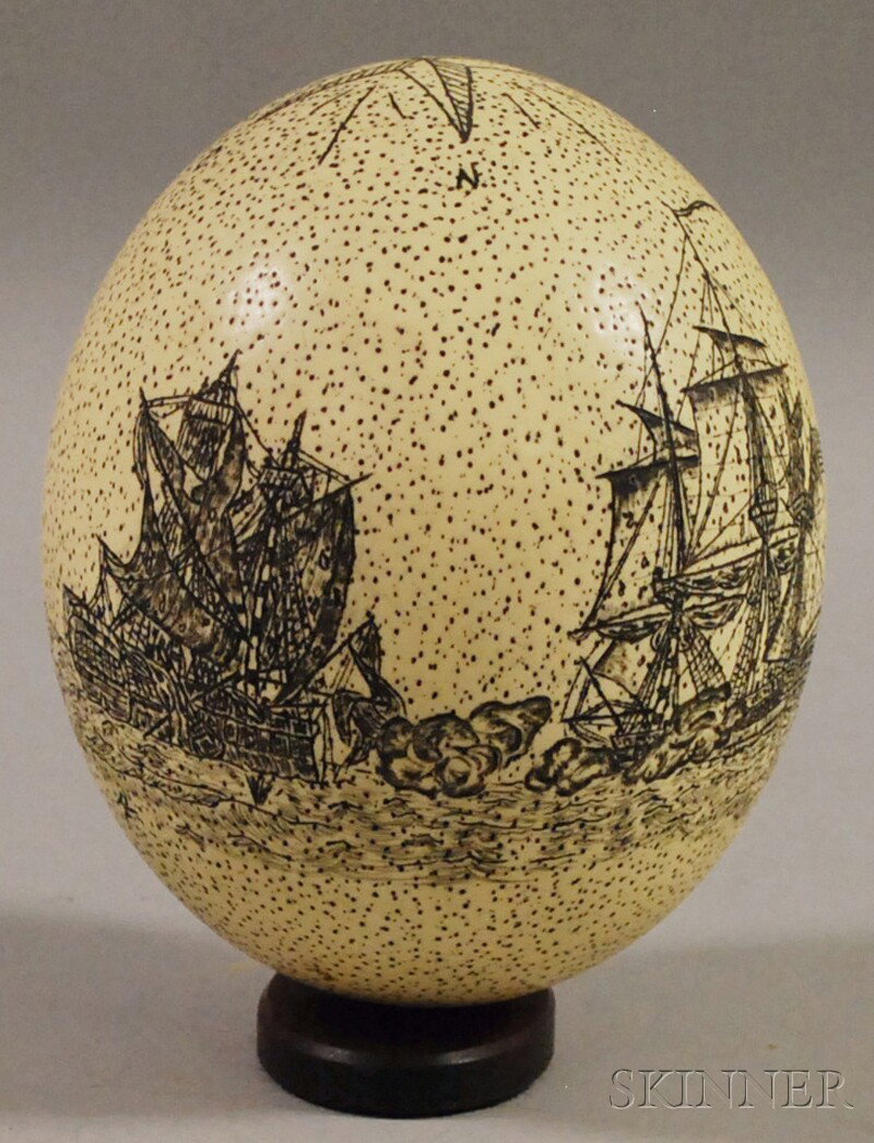 Scrimshaw-decorated Ostrich Egg, modern, depicting: Scrimshaw-decorated Ostrich Egg, modern, depicting a compass star, a naval battle, and an American eagle with arms and "U.S.A."