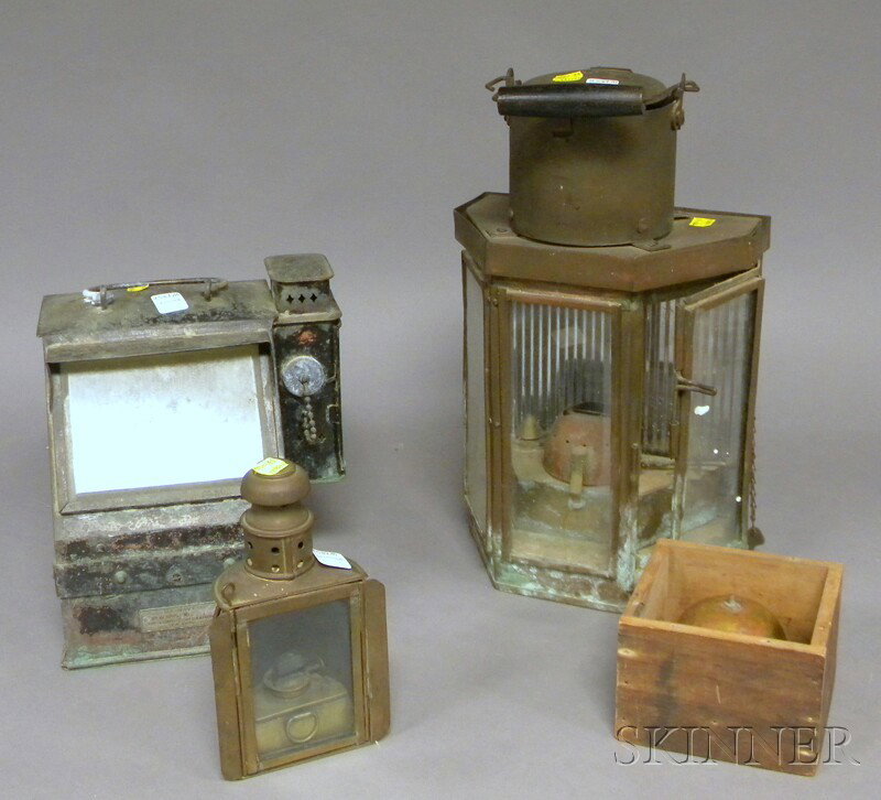 Group of Lanterns and Compasses, two brass lantern: Group of Lanterns and Compasses, two brass lanterns, a Lionel/U.S. Navy copper cased illuminated gimbal compass, and a small C.F. Hopkins brass gimbal compass in wood case.