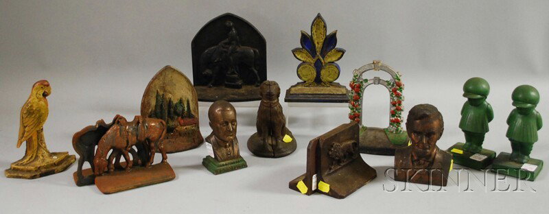 Fourteen Cast Iron and Metal Figural Items, inclu: Fourteen Cast Iron and Metal Figural Items, including five doorstops, seven bookends, and two still banks, some with paint.