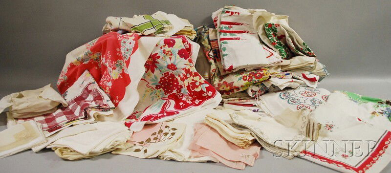 Approximately Thirty-four Vintage Printed Cotton: Approximately Thirty-four Vintage Printed Cotton Tablecloths and a Group of Other Assorted Table Linens, (with varying stains or imperfections).