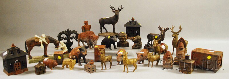 Group of Cast Iron Figural Doorstops, Still Banks: Group of Cast Iron Figural Doorstops, Still Banks, and Figures, including five doorstops, five architectural building still banks, three safe and strong box banks, and sixteen figures.