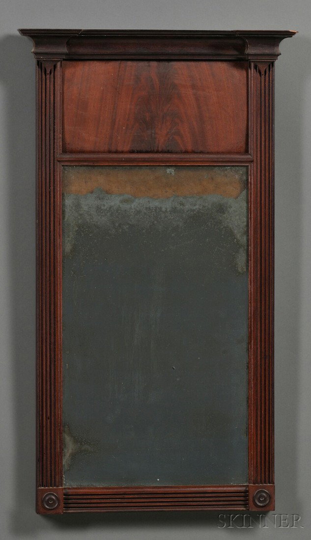 Federal Carved Mahogany Mirror, probably New Engl: Federal Carved Mahogany Mirror, probably New England, c. 1815-20, the molded cornice above a flame mahogany panel and mirror glass below, surrounded by a reeded frame, old finish, (imperfections), ht.