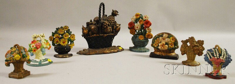 Eight Cast Iron Basket of Flowers and Fruit Doors: Eight Cast Iron Basket of Flowers and Fruit Doorstops, most painted, ht. to 11 5/8 in.
