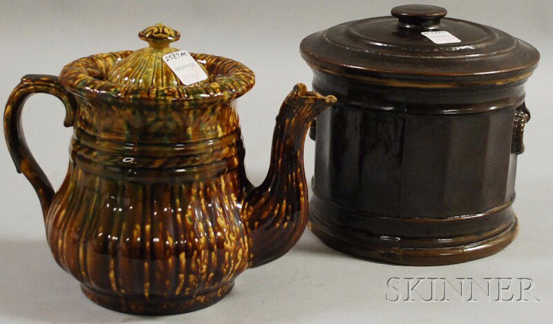 Bennington Pottery Flint Enamel Teapot and an Edm: Bennington Pottery Flint Enamel Teapot and an Edmands & Co., Albany Glazed Pottery Cookie Jar, Bennington, Vermont; Charlestown, Massachusetts, mid-19th century, ribbed cover and body with molded leav