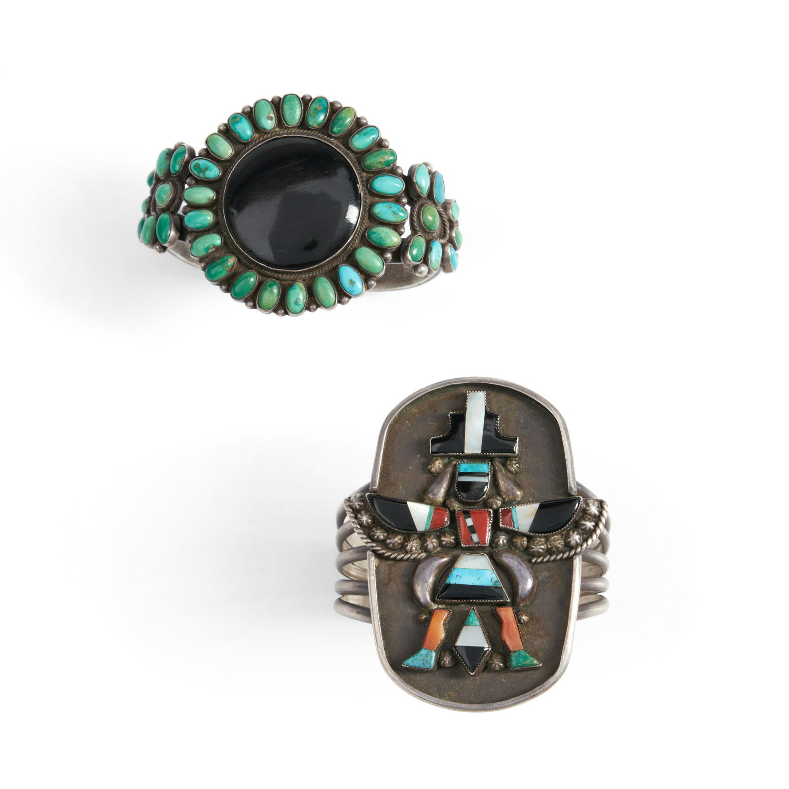 Two Zuni cuff bracelets wd. 2 3/4, interior circumference 5, with 1 gap, and wd. 1 7/8, interior...: Two Zuni cuff bracelets A five-wire cuff with a an inlay Knifewing man, and a cuff with three turquoise medallions, the largest with a round jet setting. wd. 2 3/4, interior circumference 5, with 1 ga