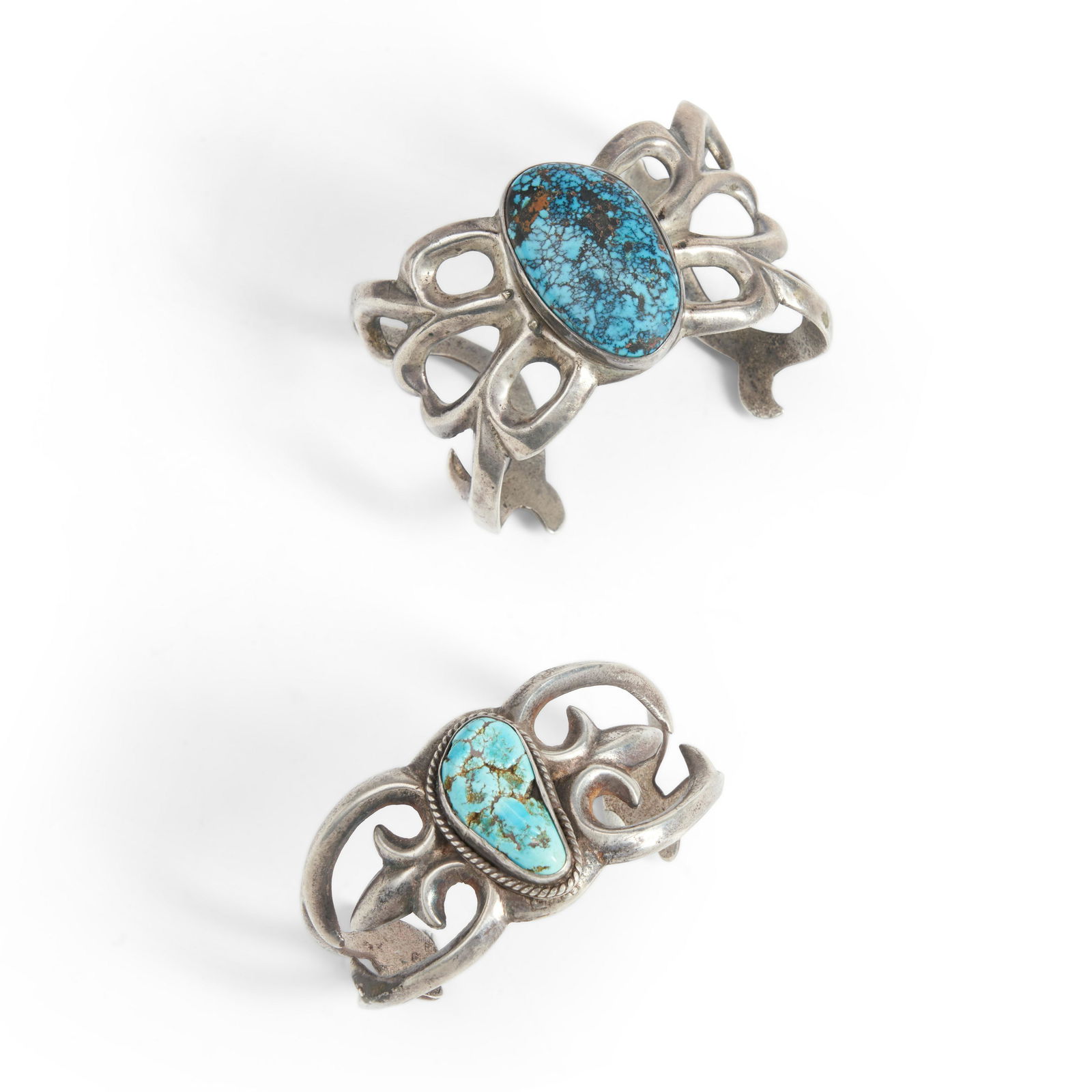 Two Southwest silver and turquoise sandcast bracelets wd. 1 1/2, interior circumference 5 1/4, w... (1 of 1)