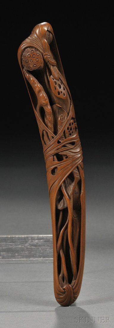 Boxwood Sashi Netsuke, Japan, 19th century, elongated s: Boxwood Sashi Netsuke, Japan, 19th century, elongated shape, carved in relief with lotus seed pods and leaves to the front, signed "Shimizu..." on the back, lg. 7 1/2 in.