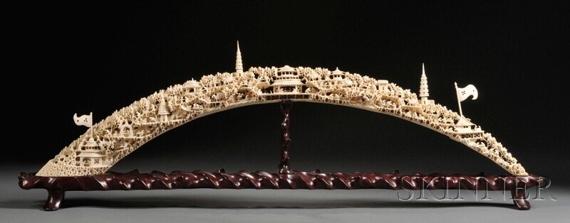 Carved Ivory Tusk, China, late 19th/early 20th century,: Carved Ivory Tusk, China, late 19th/early 20th century, intricately carved and pierced to show various scenes of citizens engaging in conversation amidst trees and pagodas, with stand, lg. 35 3/4 in.