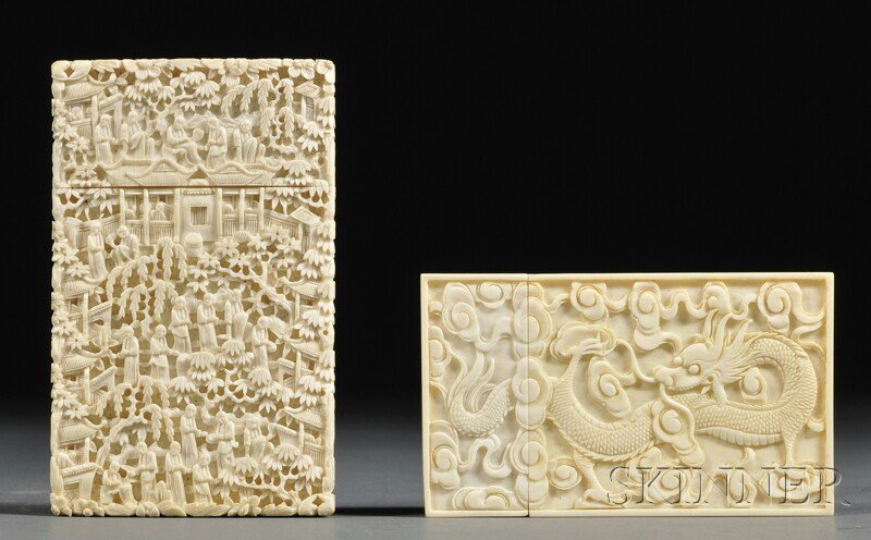 Two Ivory Card Cases, China, 19th century, one carved w: Two Ivory Card Cases, China, 19th century, one carved with a dragon amidst swirling waves and clouds, the other carved with figures in a wooded garden pavilion, 3 3/4 x 2 1/4 and 4 1/4 x 2 5/8 in., re