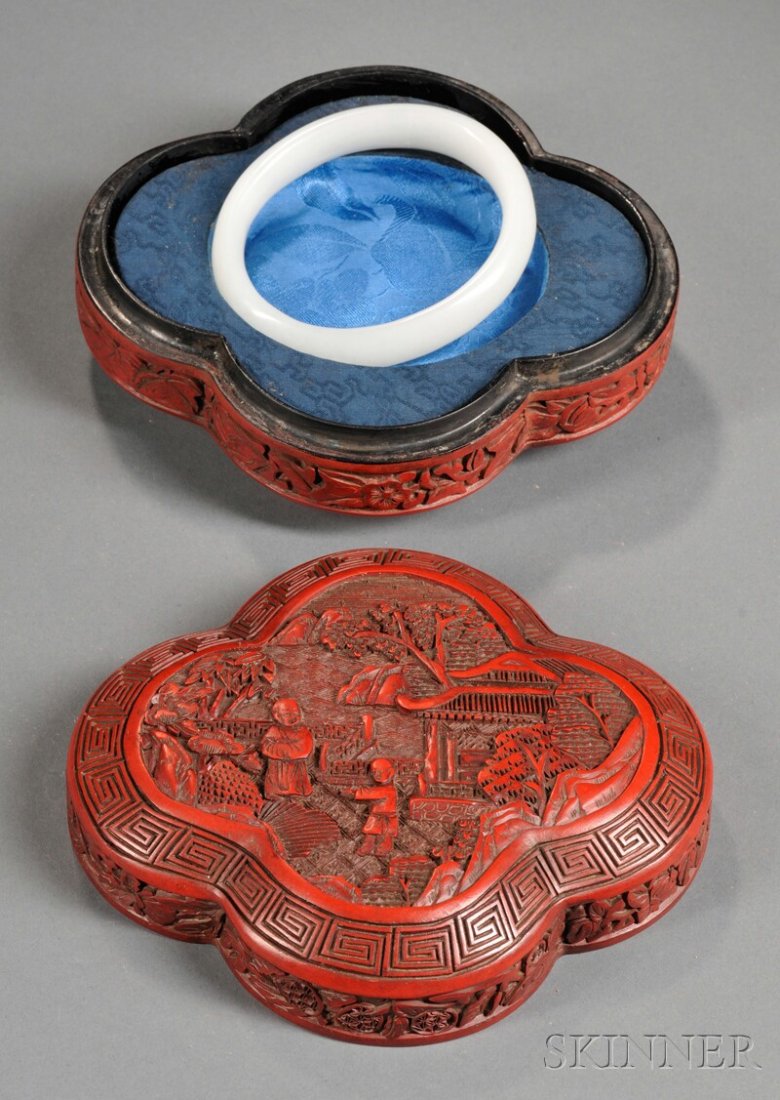 Cinnabar Box with White Jade Bangle, China, begonia pet: Cinnabar Box with White Jade Bangle, China, begonia petal shape, the cover finely carved with two figures in a backyard with a house, trees, and rocks, the edge deeply carved with a composite floral s