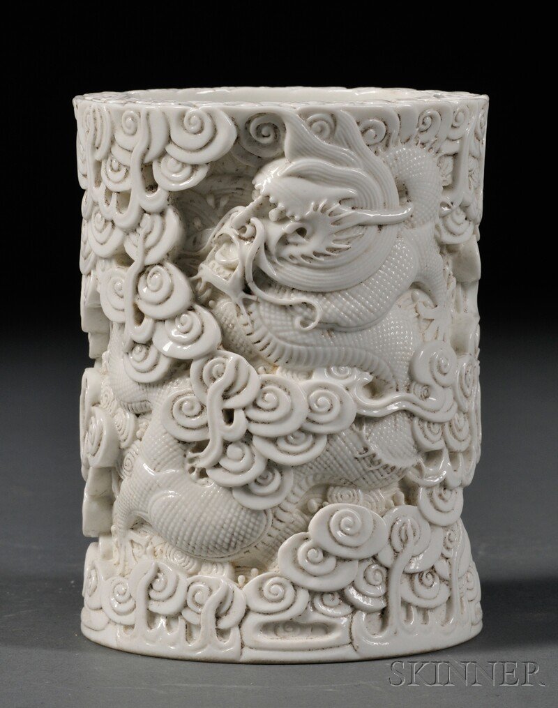 White Porcelain Brush Pot, China, 19th/20th century, cy: White Porcelain Brush Pot, China, 19th/20th century, cylindrical, continuous scene of a dragon, pearl, and clouds in high relief, four-character "wang bing rong zuo" mark on base, ht. 4 1/4 in.
