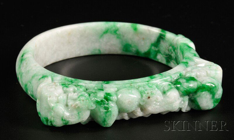 Jade Bracelet, China, one side depicting two lions and: Jade Bracelet, China, one side depicting two lions and peach branches, stone of white color with applied green markings, dia. 3 1/4 in.