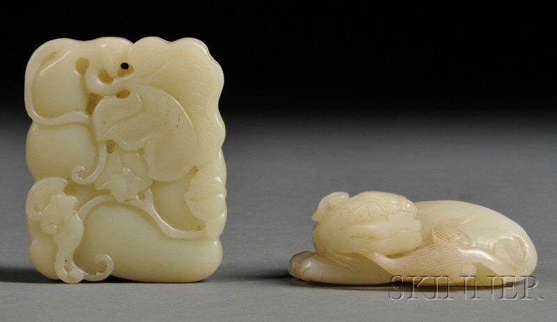 Two Jade Carvings, China, one depicting a crouching lio: Two Jade Carvings, China, one depicting a crouching lion, stone of pale celadon color, lg. 2 1/2, one pendant, depicting two bats and gourd, stone of pale-celadon color, lg. 2 1/2 in.