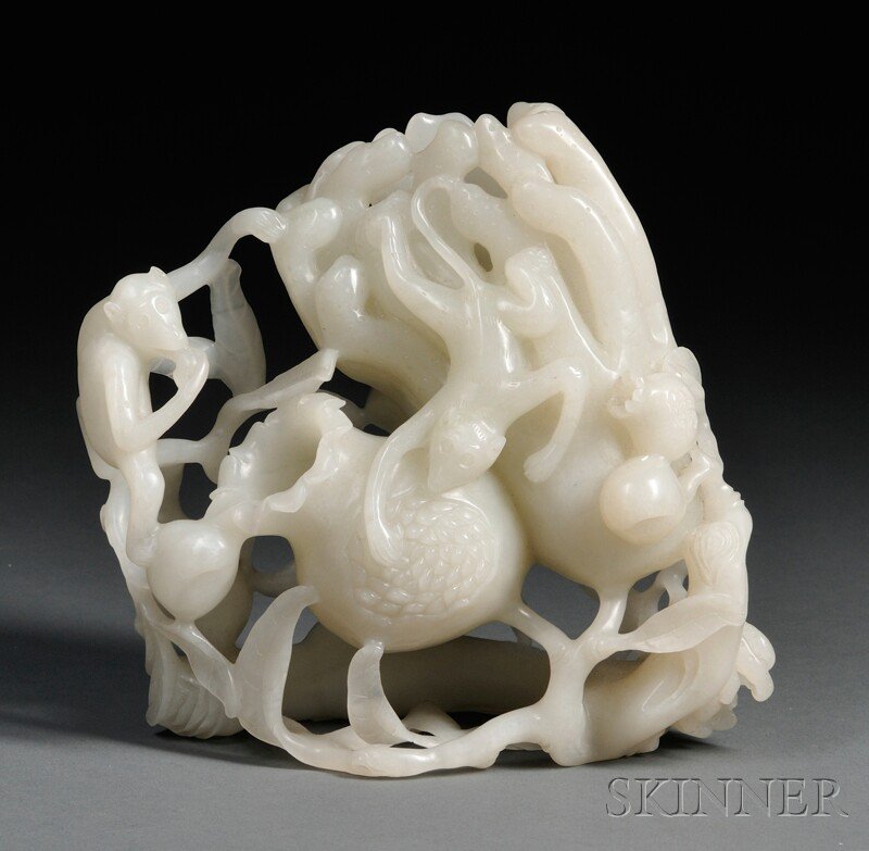 Jade Carving, China, naturalistically carved and hollow: Jade Carving, China, naturalistically carved and hollowed, depicting Buddha's hand with scrolling fingers, peach and pomegranate sprays in high relief with two monkeys eating pomegranates, stone of pa