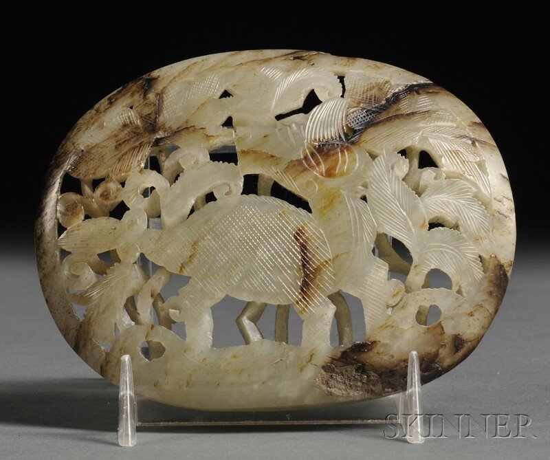 Jade Plaque, China, depicting an animal and leaves, sto: Jade Plaque, China, depicting an animal and leaves, stone of pale celadon color with russet markings, lg. 4 in.