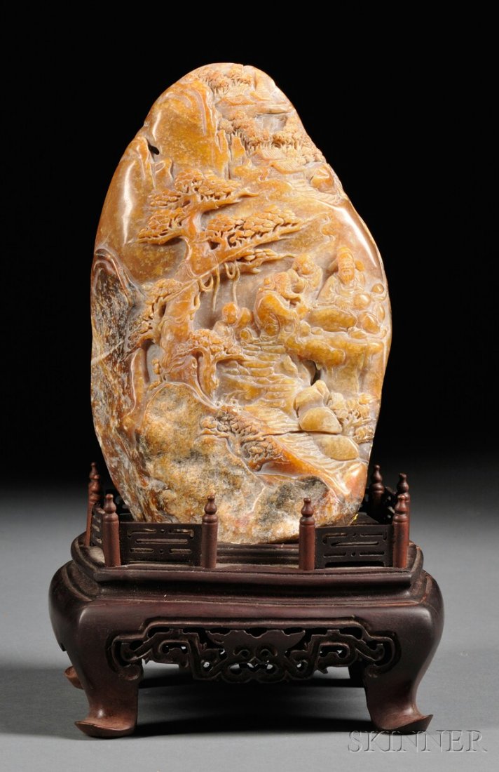 Soapstone Carving with Wood Stand, China, carved of rel: Soapstone Carving with Wood Stand, China, carved of relief with figures seated at a table, pine tree and houses with stairs in the mountain, stone of yellow-gray color, ht. 7 in.