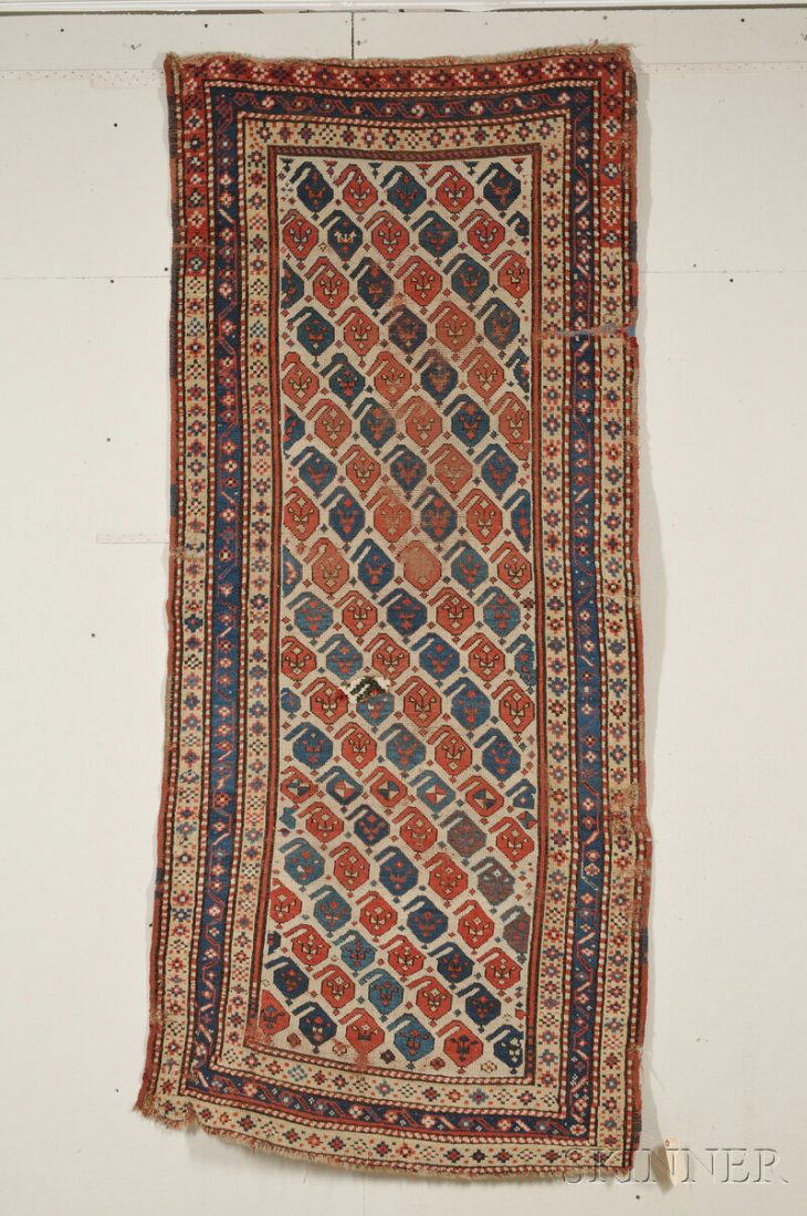 South Caucasian Long Rug, last quarter 19th centur: South Caucasian Long Rug, last quarter 19th century, (areas of wear, small rewoven area, creases, crude edge repairs), 8 ft. 6 in. x 3 ft. 9 in.