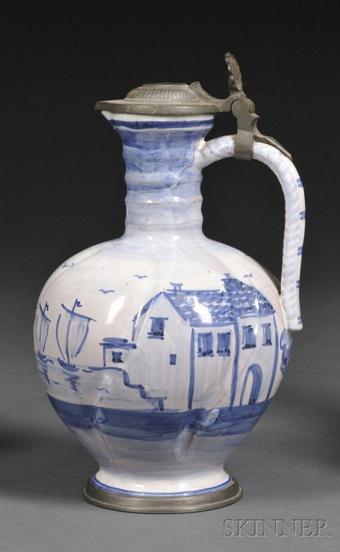 Tin-glazed Redware Ewer, likely Germany, the pewt: Tin-glazed Redware Ewer, likely Germany, the pewter lid monogrammed "B.F." and touchmark to interior, shell-form thumb-piece, and braided handle, enamel decorated with a harbor scene, ht. 9 1/4 in.