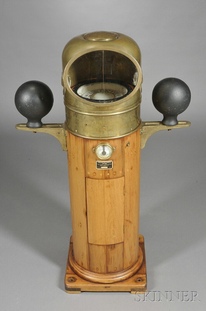 Walnut and Brass Ship's Compensating Binnacle, Lio: Walnut and Brass Ship's Compensating Binnacle, Lionel Corporation, New York, the brass hood encloses a 9-in. dia. gimbaled compass marked Kelvin White Boston and 110069, cardinal points in bold block 