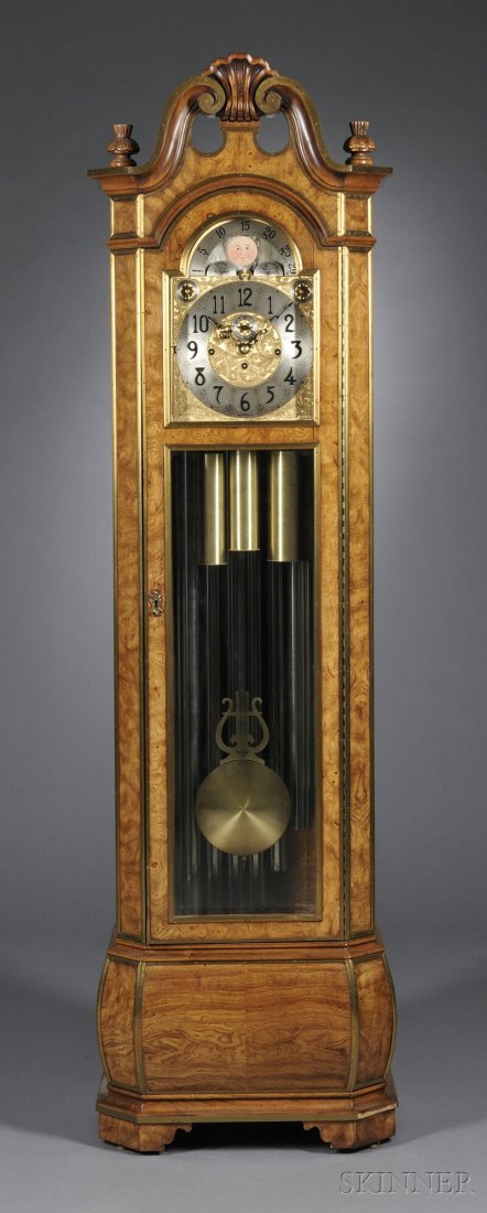 Herschede Model 250 Grandfather Clock, Spanish oli: Herschede Model 250 Grandfather Clock, Spanish olive ash veneered case with brass stringing, beveled glass door and sides, nine-tube quarter-hour and hour strike, chime and strike silent selector, eig