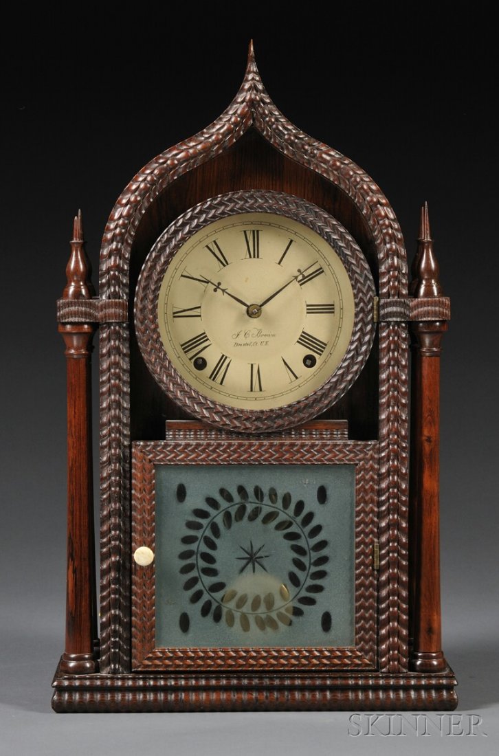 J.C. Brown Rosewood Ripple-Molded Ogee Gothic Shel: J.C. Brown Rosewood Ripple-Molded Ogee Gothic Shelf Clock, Bristol, Connecticut, c. 1845, the twin spire case with painted zinc Roman numeral dial signed J.C. Brown, Bristol Ct. U.S., etched tablet, p