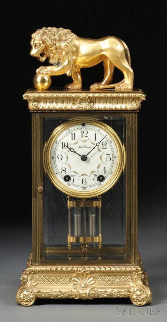 Seth Thomas "Empire No. 13 and Lion" Crystal Regul: Seth Thomas "Empire No. 13 and Lion" Crystal Regulator, Thomaston, Connecticut, c. 1910, the gilt-brass and beveled glass case capped by a mythological lion, top and base cast with decorative roping a