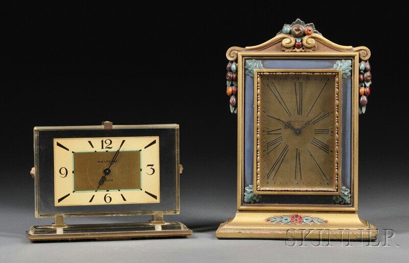 Two Waltham Eight-day Desk Clocks, Waltham Watch C: Two Waltham Eight-day Desk Clocks, Waltham Watch Company, c. 1950, the first in a Lucite case, gold toned dial with Arabic numerals and marked Waltham 8 Days, the last in a painted and carved wooden c