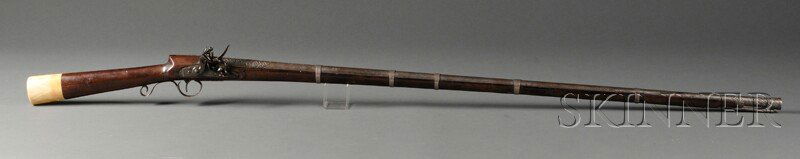 Persian Musket, 19th century, Manton marked flintl: Persian Musket, 19th century, Manton marked flintlock, silver trigger guard and barrel bands, walnut stock with ivory butt plate, lg. 62 in.