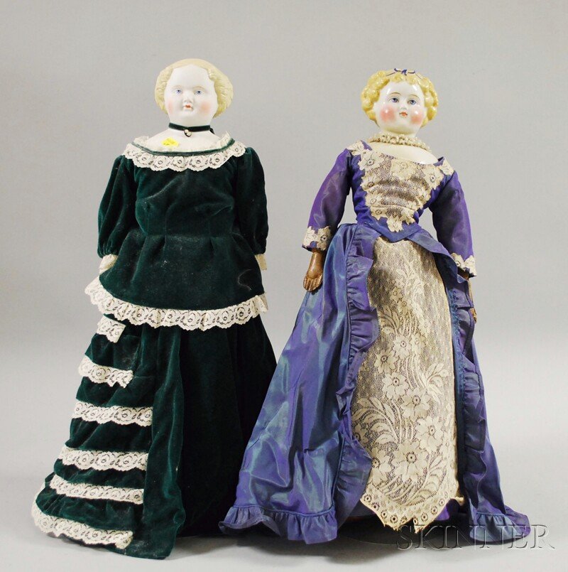 Blonde China Doll and Blonde Parian Doll, Germany, : Blonde China Doll and Blonde Parian Doll, Germany, china with curly hair, blue bow, cloth body, kid arms, ht. 21; pale blonde parian, center part hair, kid body, bisque lower arms, ht. 22 in.