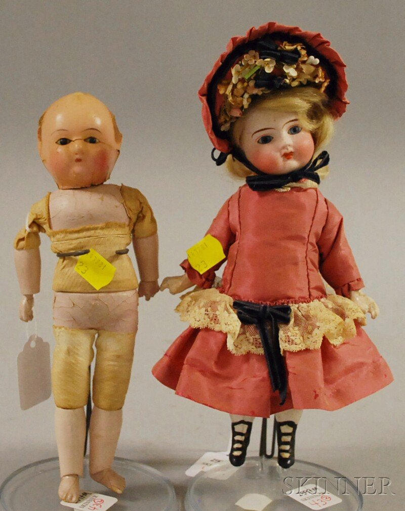 Two Small Dolls, a papier-mache Mostschmann-type wi: Two Small Dolls, a papier-mache Mostschmann-type with wax-over head and a closed mouth bisque girl marked H3, five-piece composition body, both ht. 8 1/2 in.