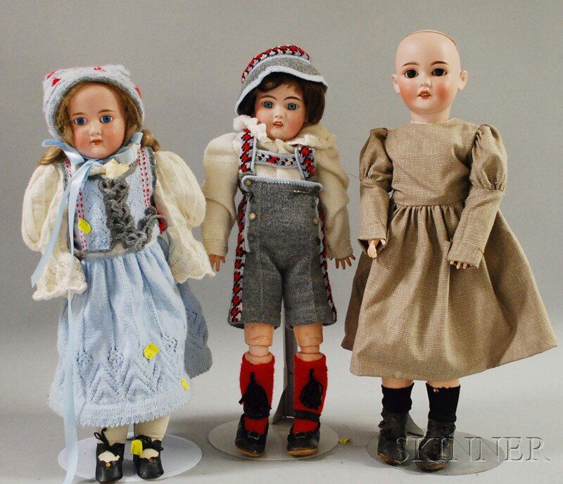 Three German Bisque Head Dolls, Queen Louise, join: Three German Bisque Head Dolls, Queen Louise, jointed body, ht. 24; Simon Halbig 1079 and Florodora shoulder head redressed in matching boy and girl knit outfits, ht. 22 in.