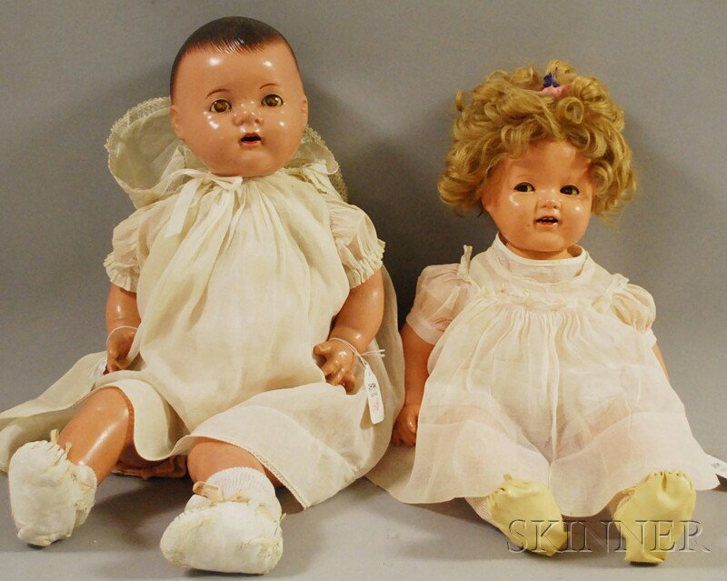 Two Large Composition Baby Dolls, an Ideal Shirley: Two Large Composition Baby Dolls, an Ideal Shirley Temple baby with flirty eyes, blonde curly mohair wig, and a Madame Alexander Dionne quint baby, molded hair, both with composition arms and legs, cl