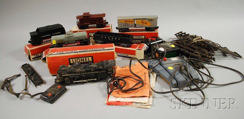 Group of Lionel Electric Trains with Accessories, : Group of Lionel Electric Trains with Accessories, two transformers, track, plastic 6066T tender, 3474 box car, 6032 gondola car, 6037 caboose, 6035 tank car, and metal 2037 engine.