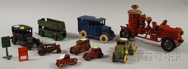Eleven Painted Cast Iron Toy Vehicles and Accessor: Eleven Painted Cast Iron Toy Vehicles and Accessories, including Hubley "Borden's Milk Truck," firefighting pumper, and a truck, Arcade double-decker bus, a small touring car, steamroller, truck, a ca